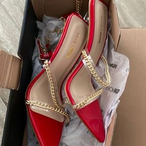 Red heels size 7. Never worn.